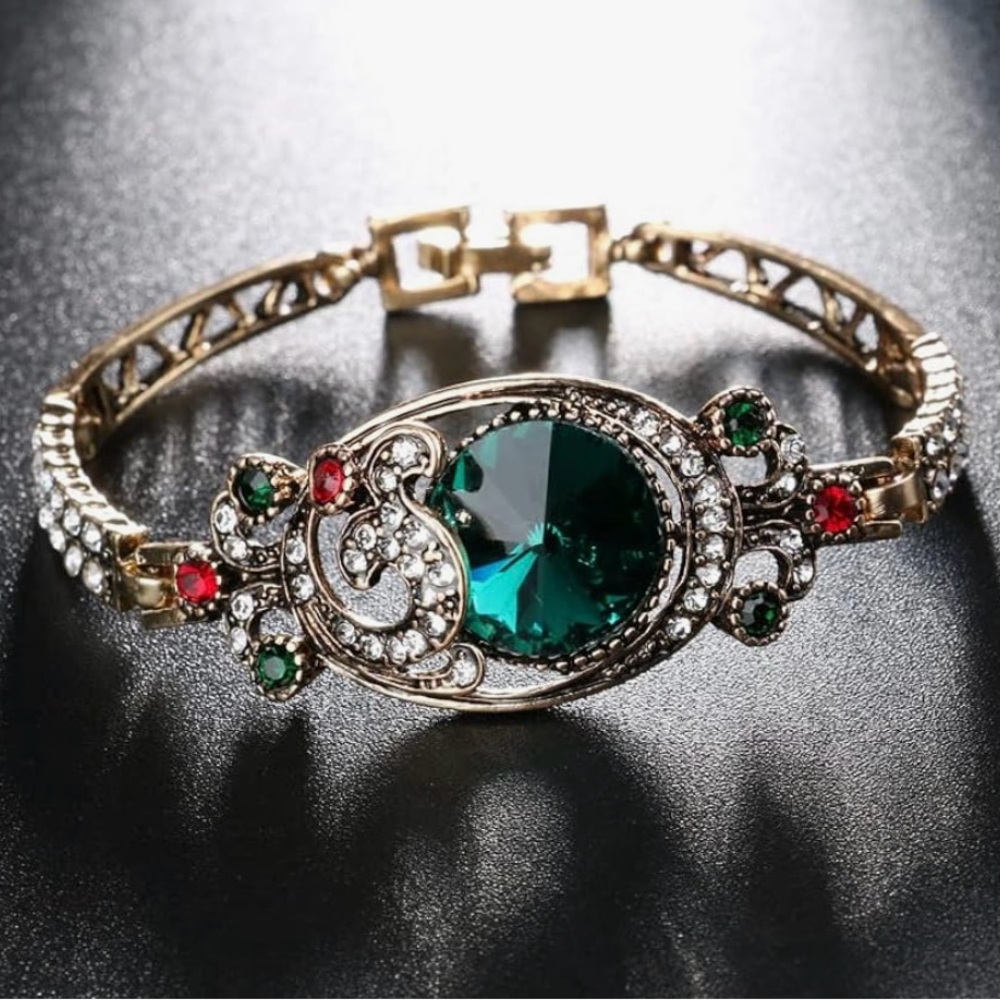 Elegant Gold and Green Gemstone Bracelet

Vintage Bangles Turkish Color Antique